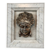 Female mascaron in grey Ardennes marble from the Regency period, 18th century.