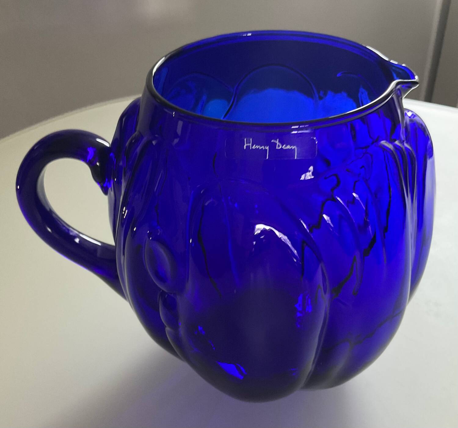 Vintage cobalt blue glass pitcher by Henry Dean