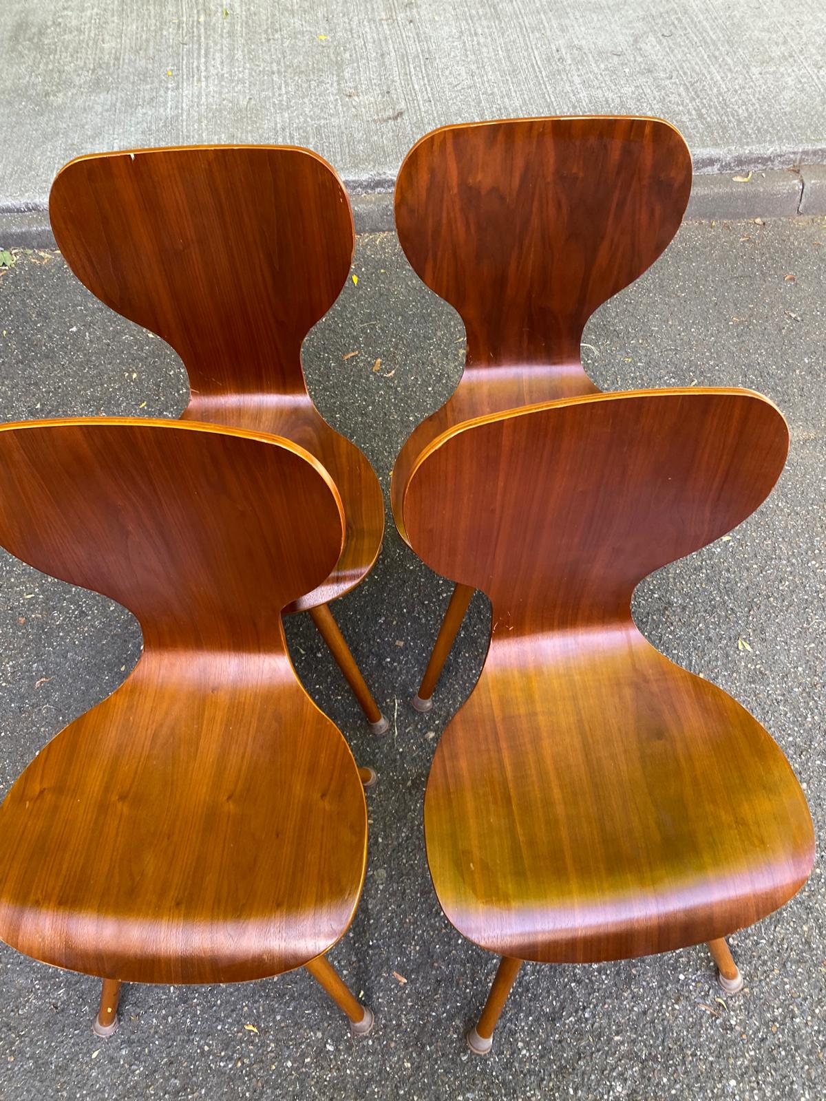 4 vintage Scandinavian dining chairs in curved walnut.