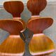 4 vintage Scandinavian dining chairs in curved walnut.