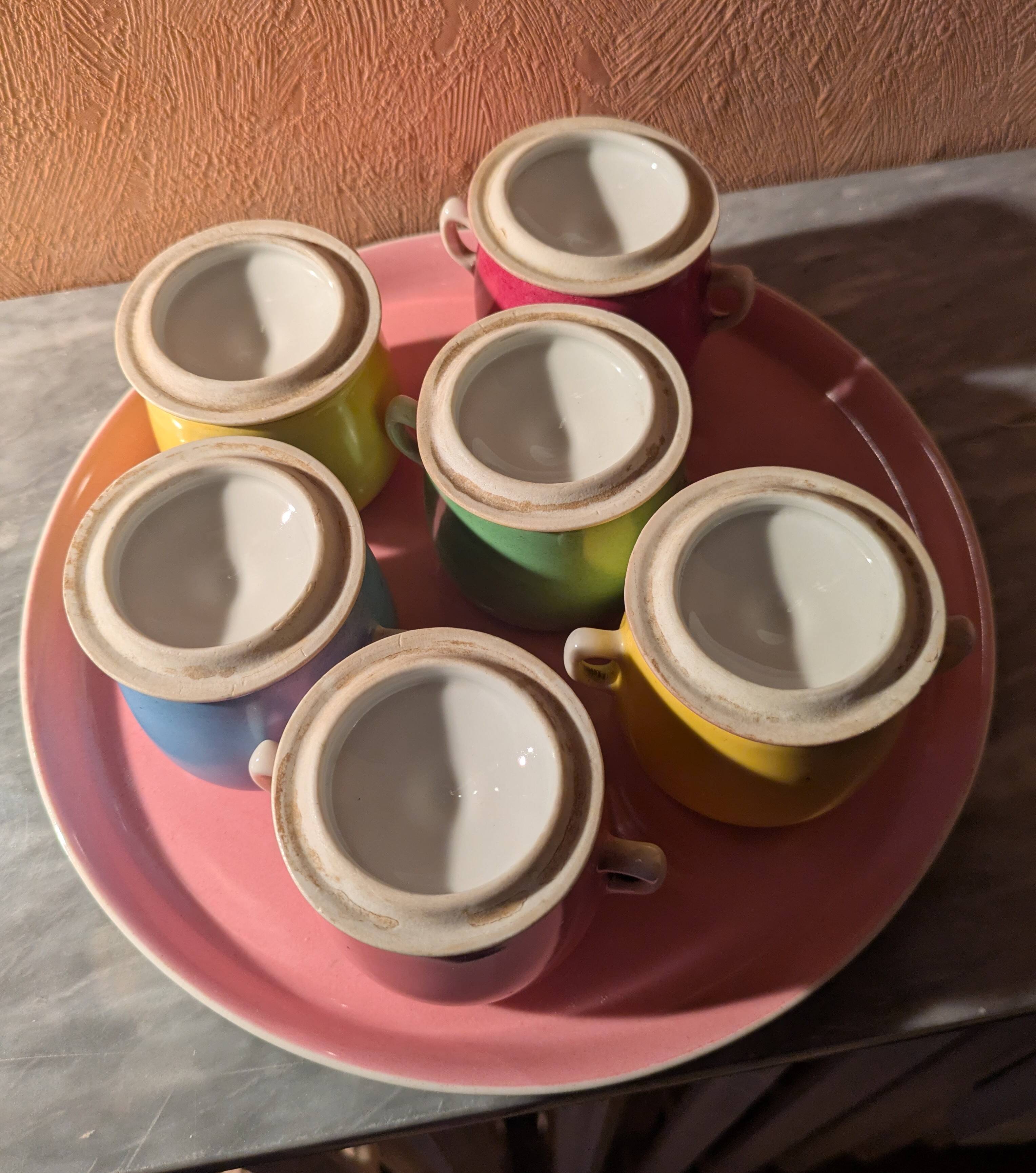 6 small porcelain cream pots from Limoges with a tray.