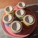 6 small porcelain cream pots from Limoges with a tray.
