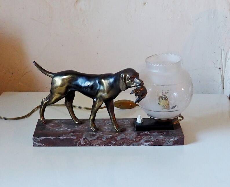 French Art Deco hunting dog on a marble base with a switched lamp.