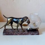 French Art Deco hunting dog on a marble base with a switched lamp.