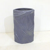 Purple vase, draped ribbons in relief