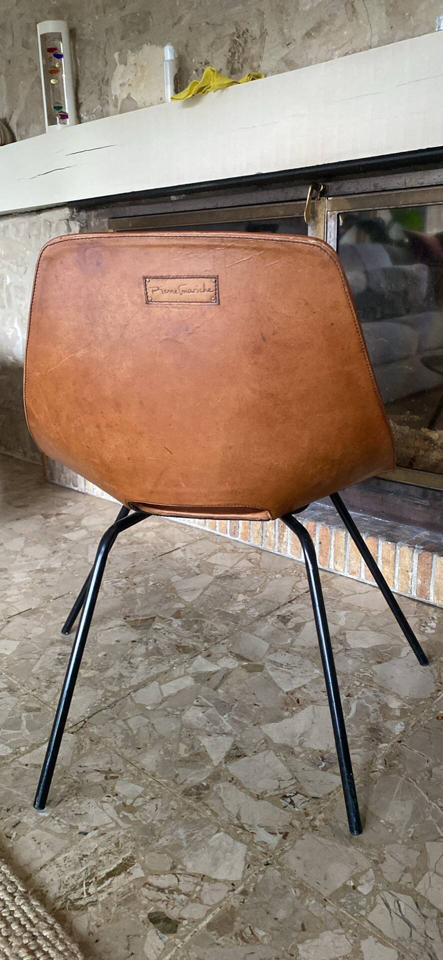 Leather chair by Pierre Guariche