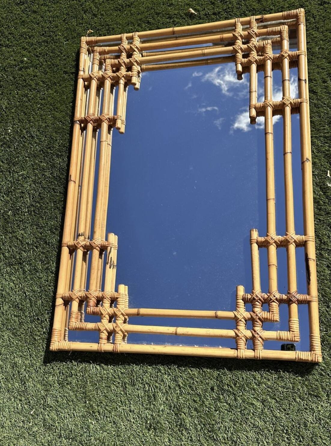 Large sculptural mirror handmade from natural bamboo and woven rattan, 1960.