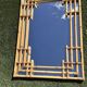 Large sculptural mirror handmade from natural bamboo and woven rattan, 1960.