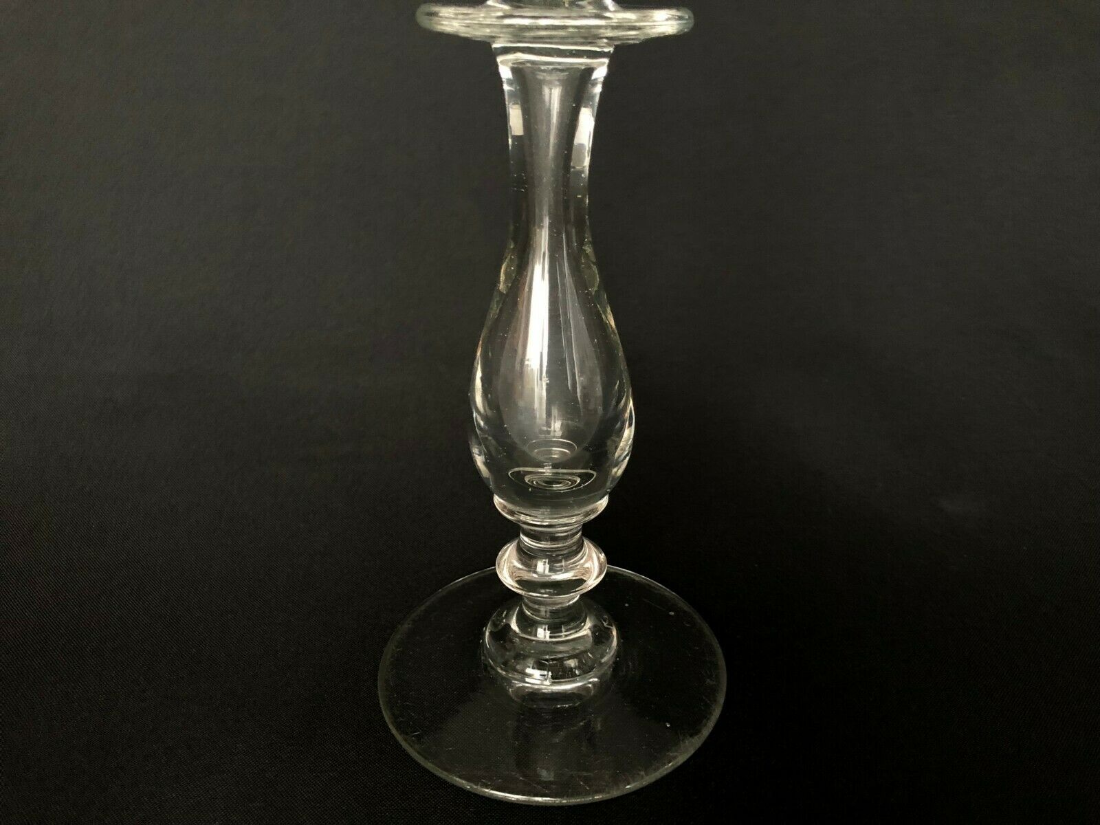 Glass oil lamp blows on foot shower