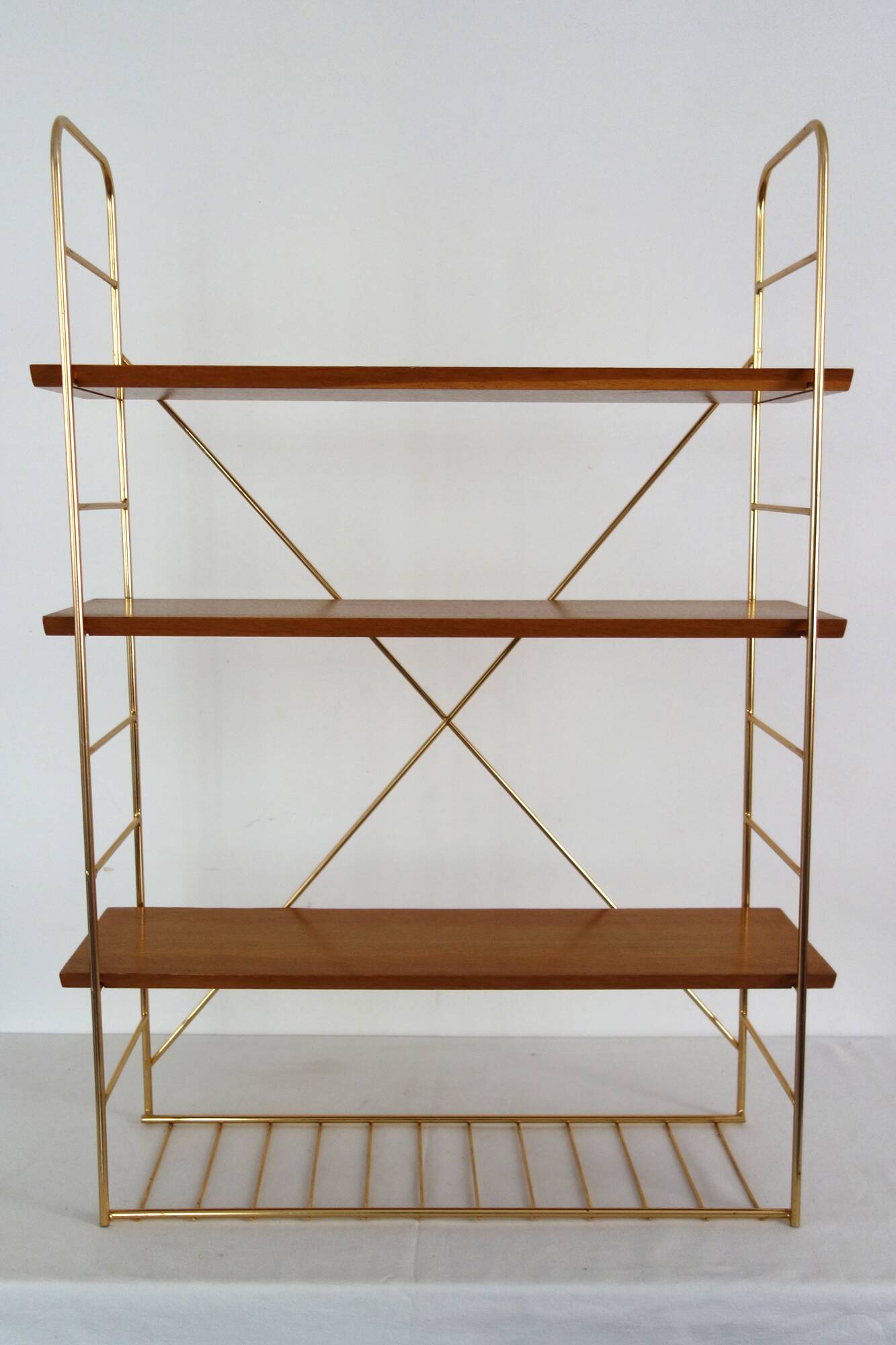 String wall shelf in gold metal and wood from the 60s