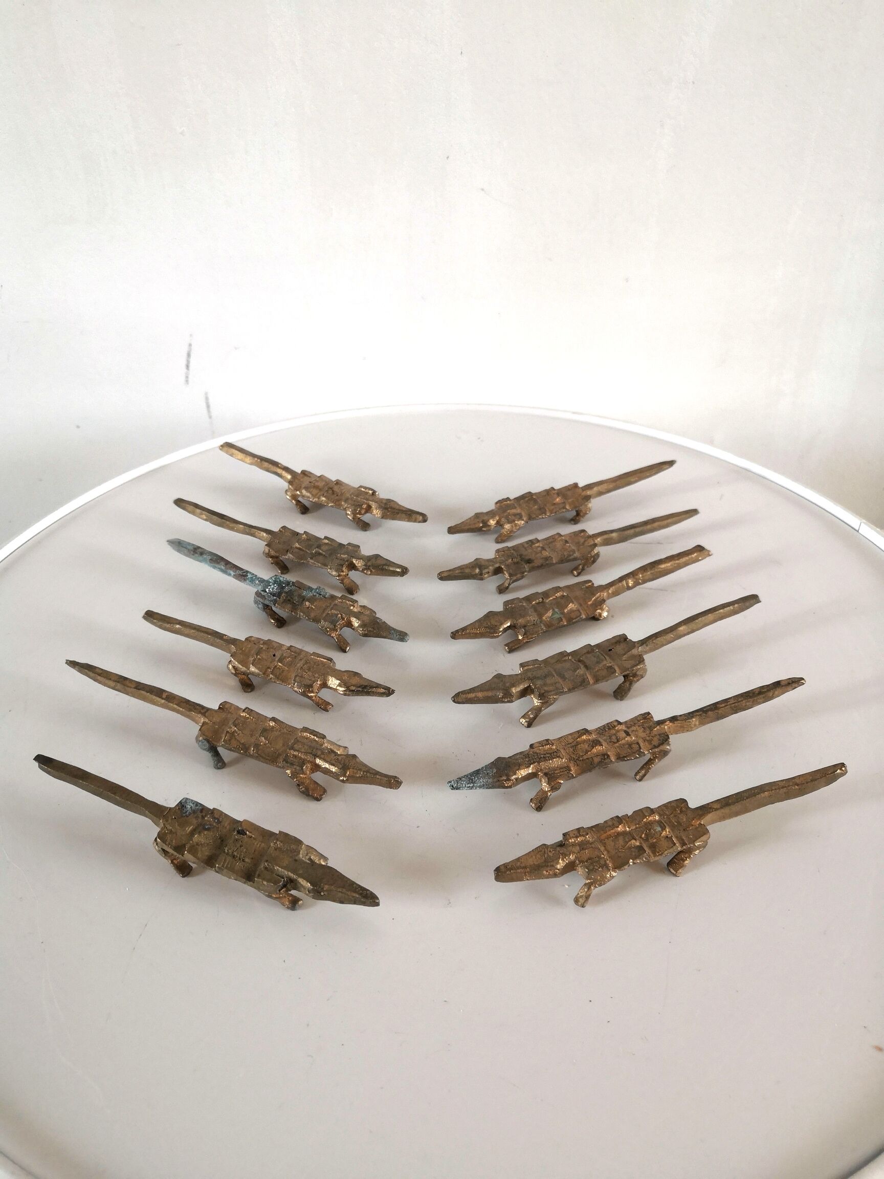 12 vintage bronze knife rests