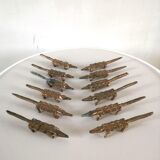 12 vintage bronze knife rests