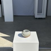 Small white ball vase tight neck in glazed speckled ceramic