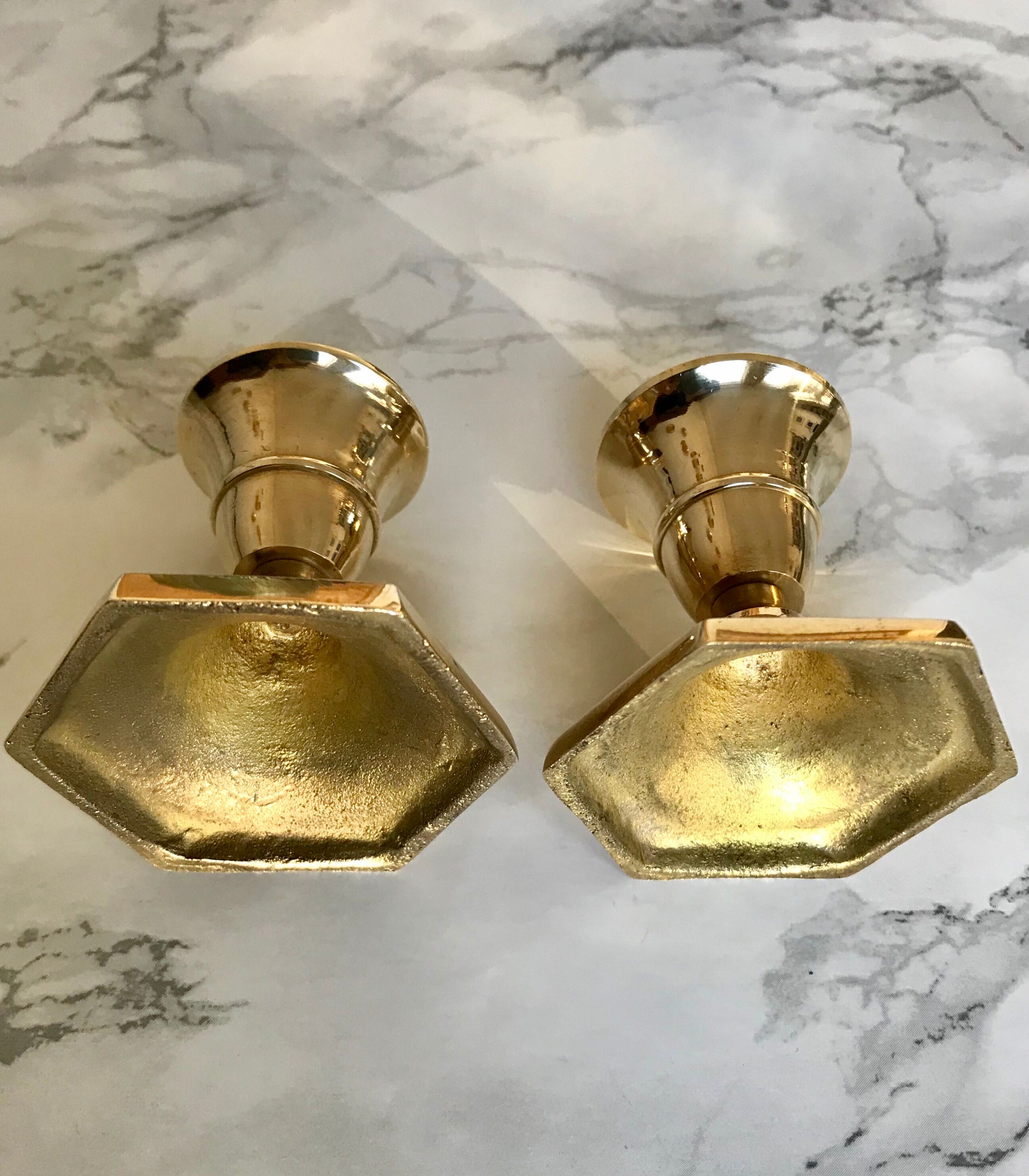 Set of three candlesticks in brass