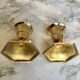 Set of three candlesticks in brass
