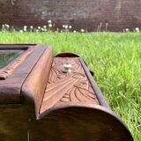 Old carved wooden medicine cabinet with beveled mirror