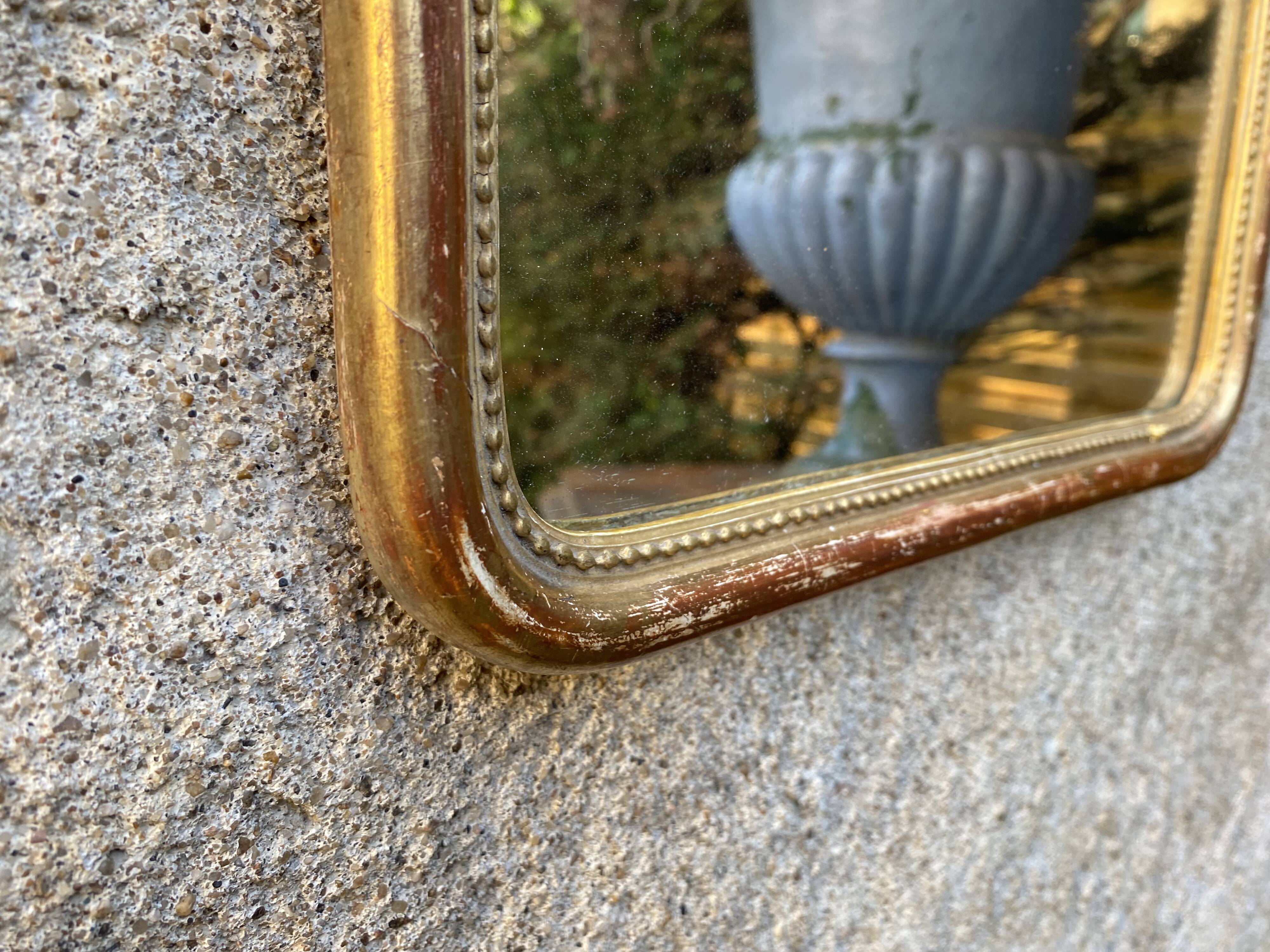Louis-Philippe mirror gilded with gold leaf