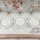 Set of 7 Limoges porcelain dinner plates by A. Vignaud