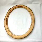 Old oval gilded wooden frame with domed glass
