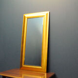 Large mirror in a golden decorative frame