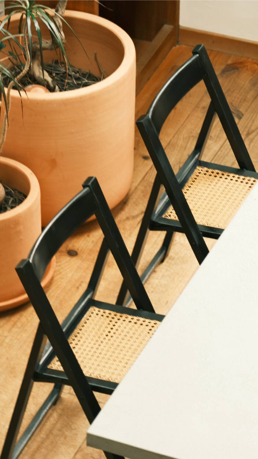 4 black cane folding chairs