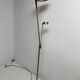 Golden metal floor lamp with reading light