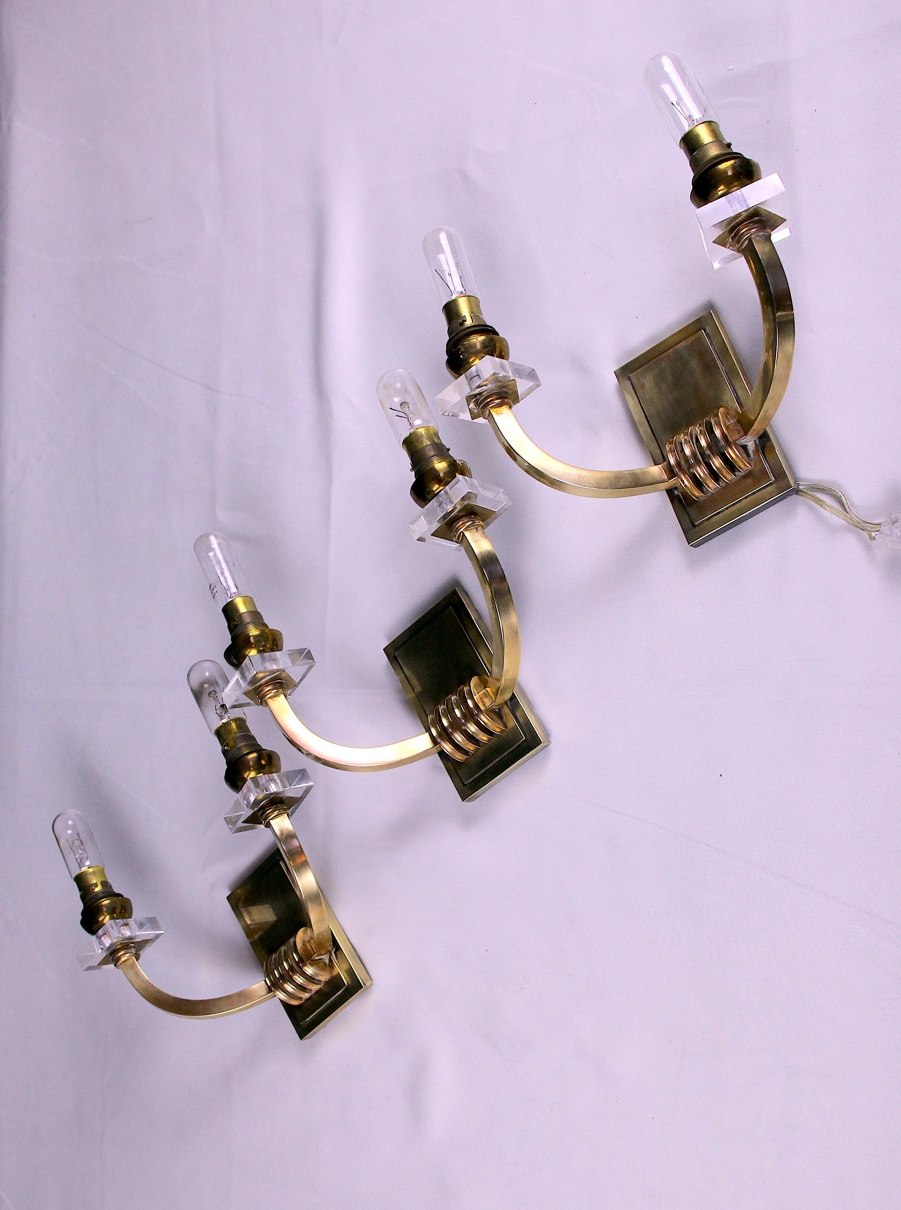 Three double wall lamps  Brass and lucite, France Mid-Century