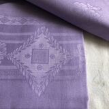 Old damask tablecloth in linen and purple silk