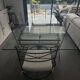Roche Bobois glass and steel dining table and 6 chairs