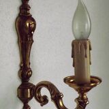 Simple wall sconce in classic Empire style in vintage French bronze.