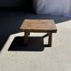 Small stool, rectangular solid teak side table with curved legs.