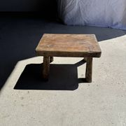 Small stool, rectangular solid teak side table with curved legs.