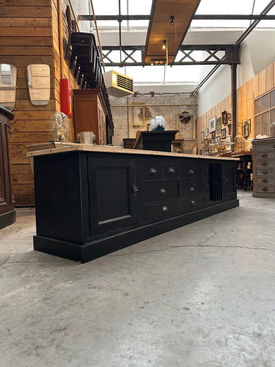 Old workshop furniture transformed into a TV unit.