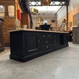 Old workshop furniture transformed into a TV unit.