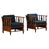 Art Nouveau, pair of oak lounge chairs, reupholstered in style fabric, 1920s.