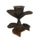 Patinated green brass candlestick with foliage decoration.