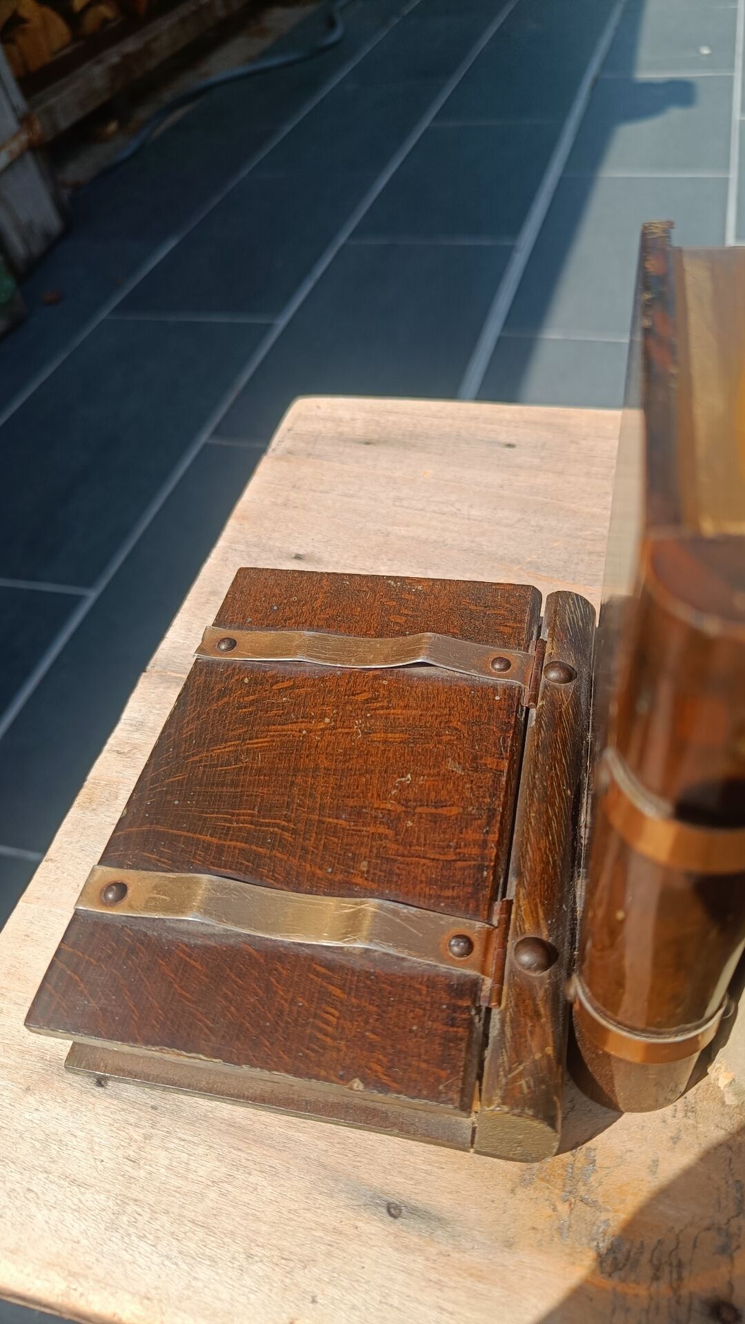 Wooden trompe-l'œil bookends with a book and box