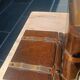 Wooden trompe-l'œil bookends with a book and box