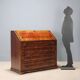 Antique drop-leaf cabinet in various types of wood, Italy, 18th century.