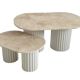 Oval coffee table duo travertine and white fluted wooden legs.