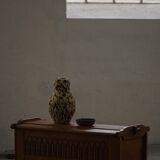 Modern Danish oak commode with decorative relief sculpture, mid-20th century.