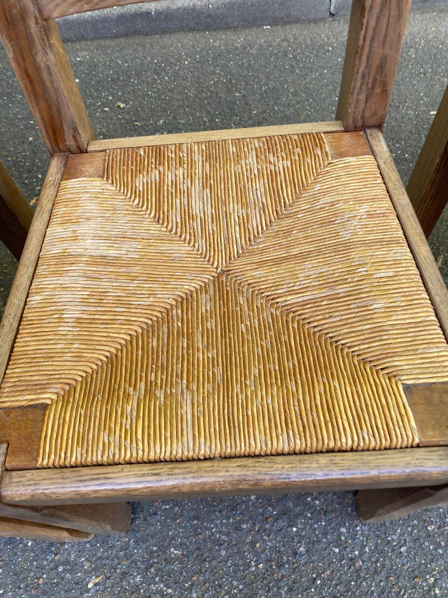 8 wooden dining chairs with straw seats, farmhouse style, high back.