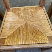 8 wooden dining chairs with straw seats, farmhouse style, high back.