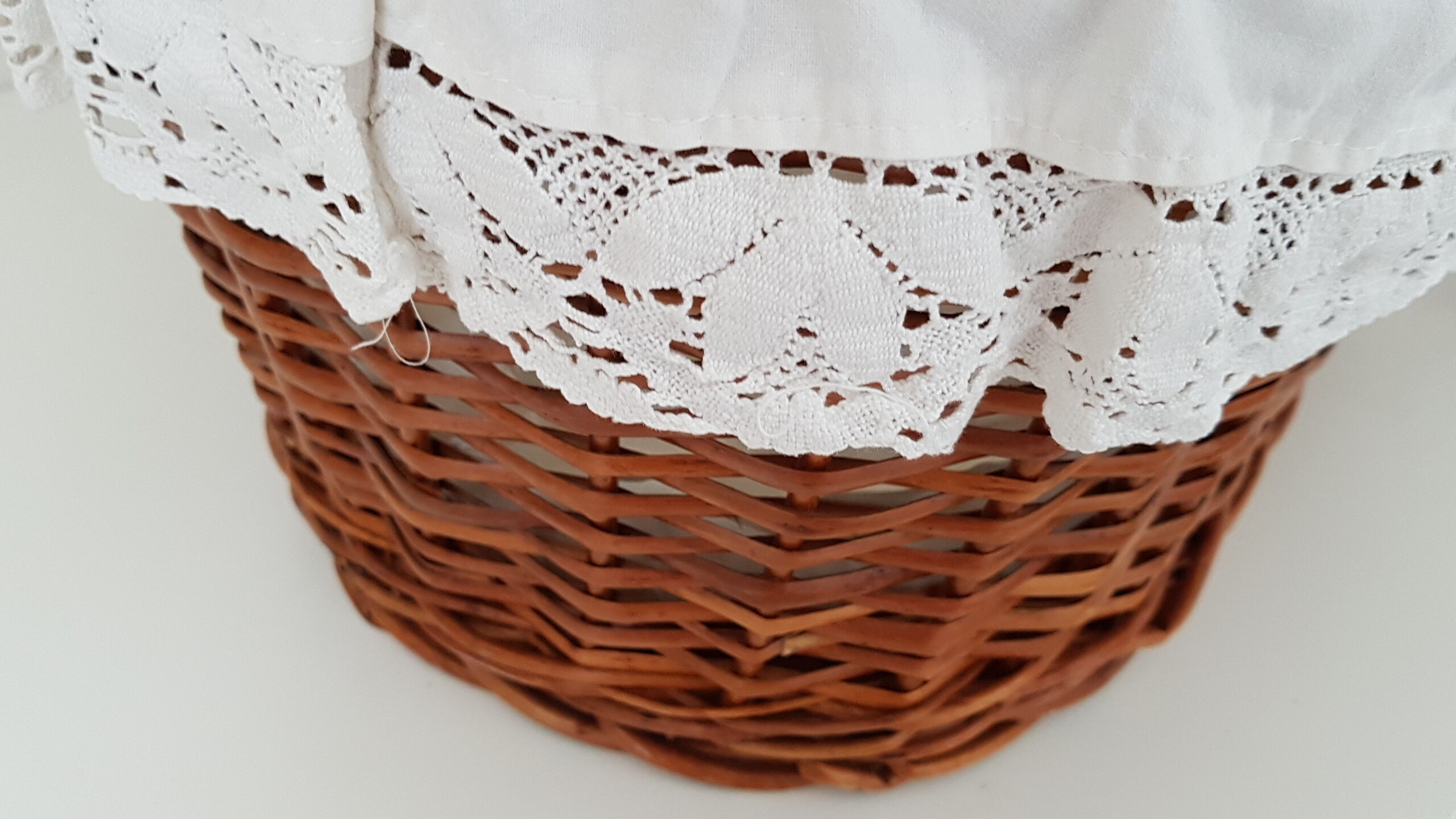 Old rattan bassinet and bedding
