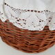 Old rattan bassinet and bedding