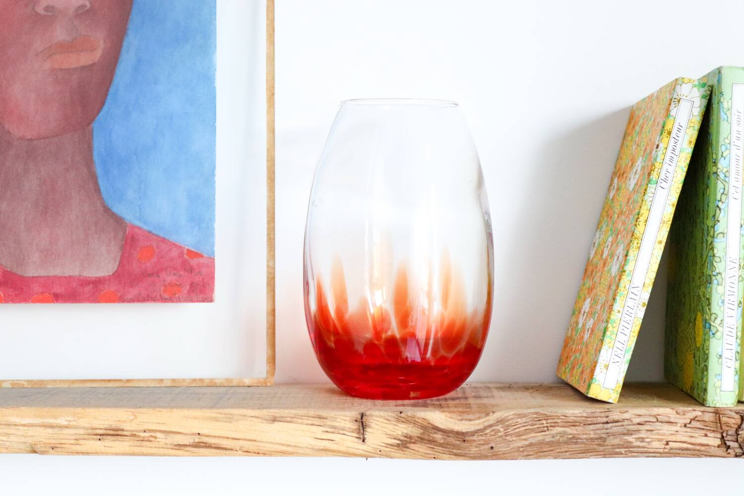 Vintage blown glass vase with a speckled red design