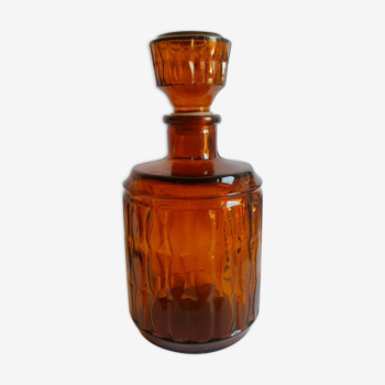 Amber glass decanter with vintage cap