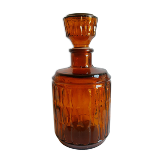 Amber glass decanter with vintage cap