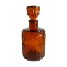 Amber glass decanter with vintage cap