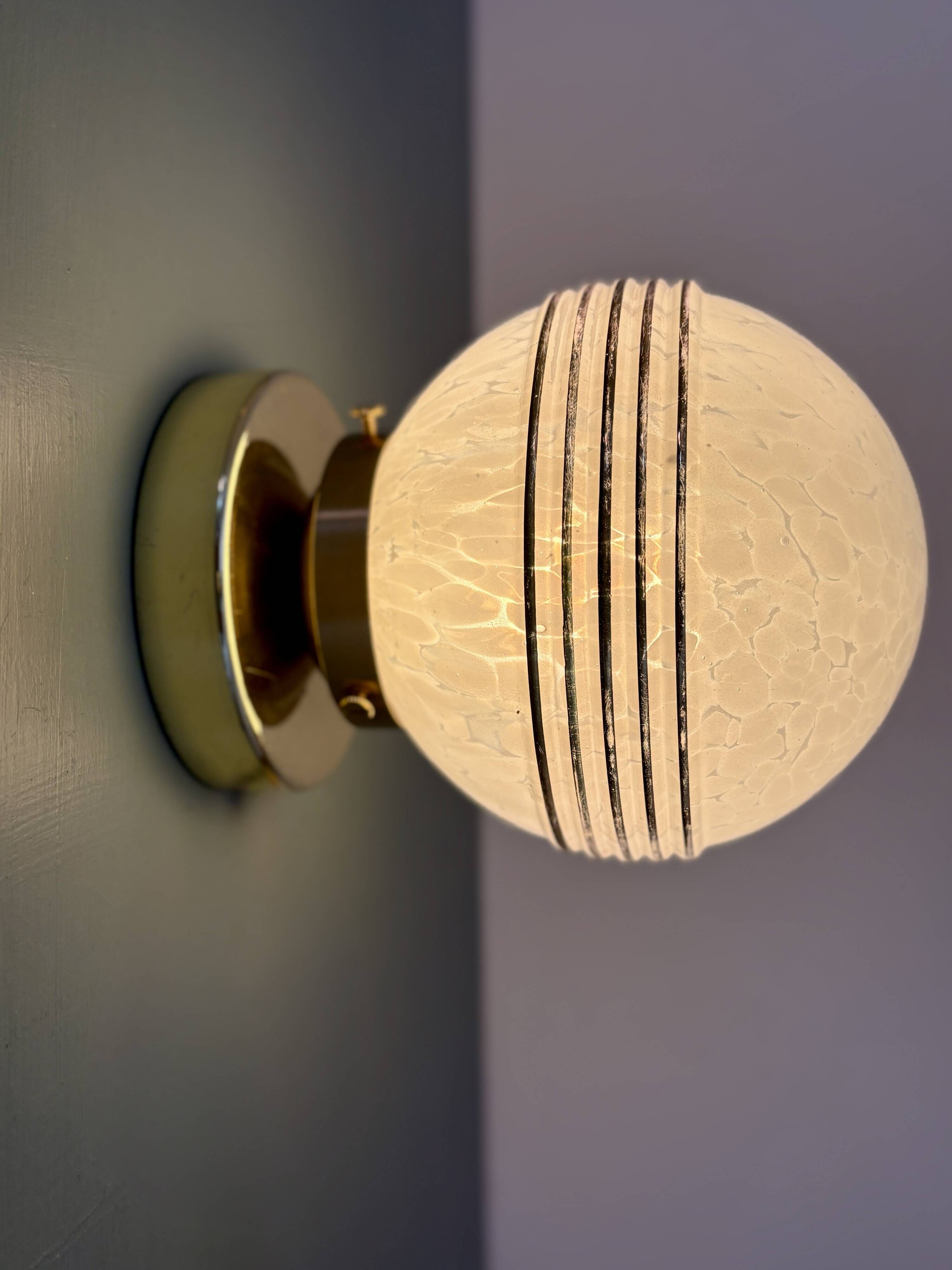 Vintage glass globe wall or ceiling light in white and gold from Clichy.